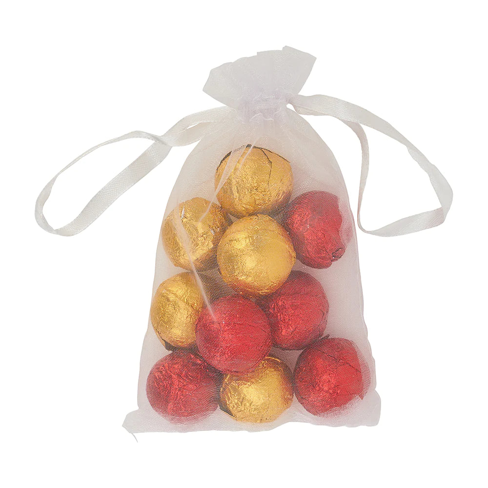 gold and red mini bath fizzers in a small see through gift back on white background. Perfect for a christmas gift box delivery.
